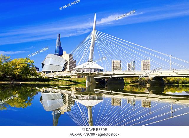 Winnipeg skyline from St. Boniface showing the Red River, Esplanade Riel Bridge and Canadian Museum for Human Rights, Manitoba, Canada