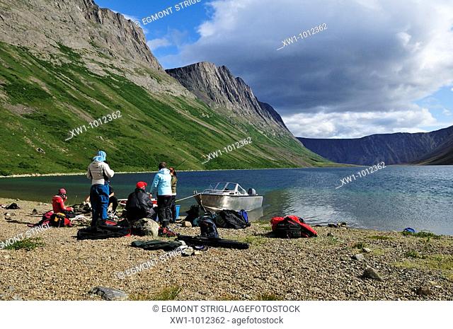 group of tourists on a beach at North Arm of Saglek Fjord, Torngat Mountains National Park, Newfoundland and Labrador, Canada