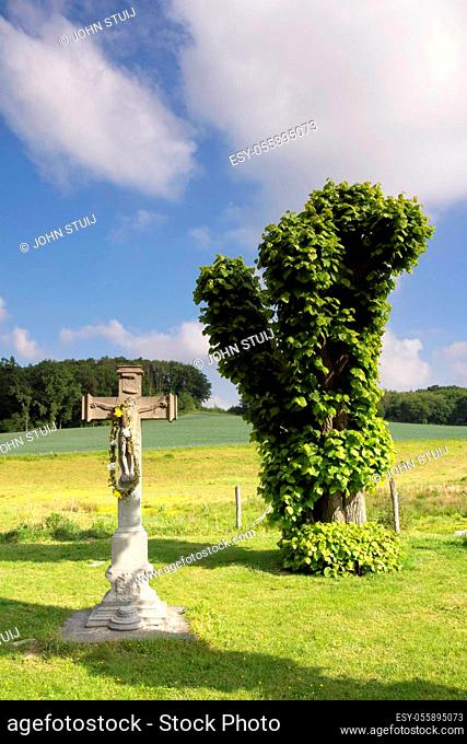 Wayside cross near Terborgh castle in the Dutch village Schinnen in the most southern province Limburg