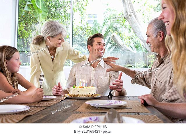Caucasian family celebrating birthday at table