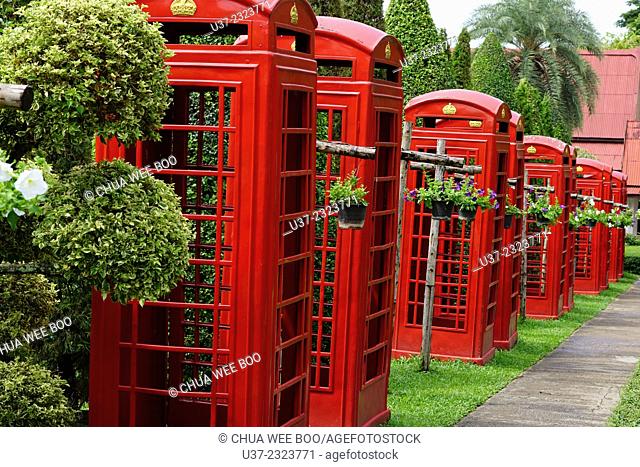 Red telephone booths at Nong Nooch Village Garden, Thailand