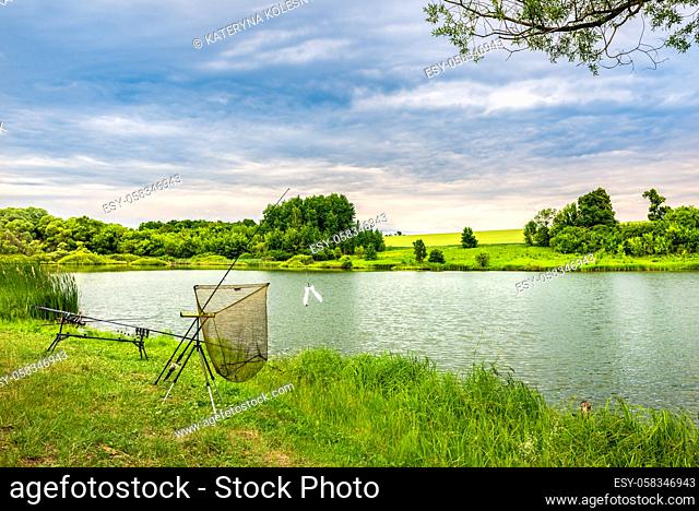 Fishing in overcast weather on countryside river