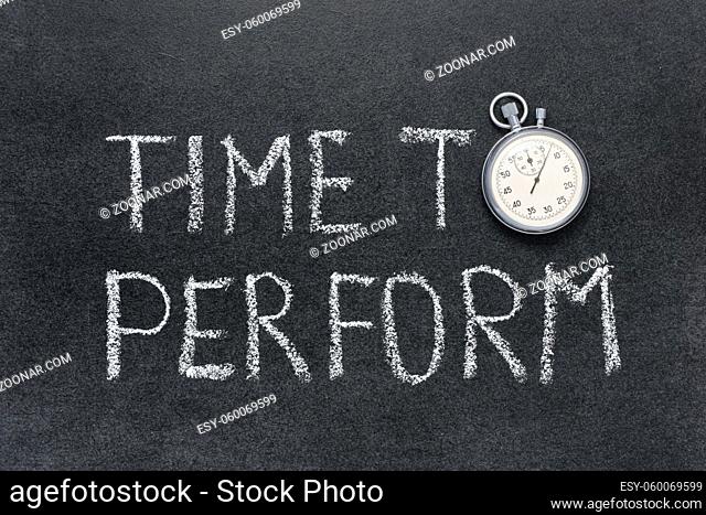 time to perform phrase handwritten on chalkboard with vintage precise stopwatch used instead of O