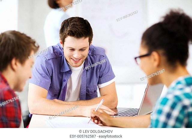 education concept - group of students studying at school