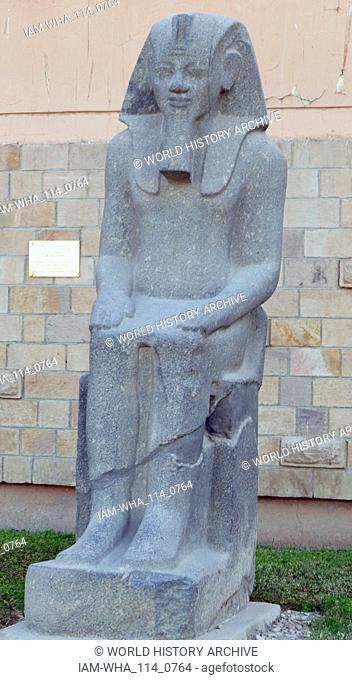 Unfinished seated statue of King Amenhotep III of Egypt. 18th dynasty; 1403-1365 BC. Grey Granite. Temple of Luxor