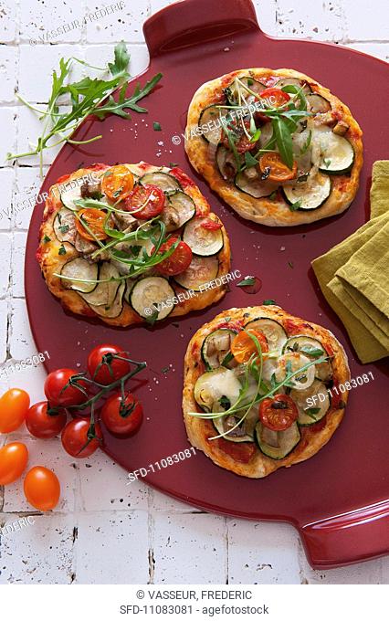 Mini pizzas topped with grilled vegetables
