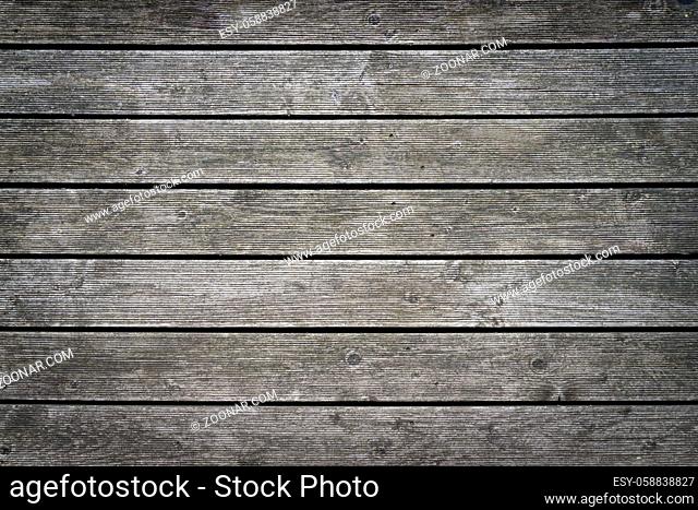 Rustic wood planks background with nice studio lighting and elegant vignetting spotlight to draw the attention