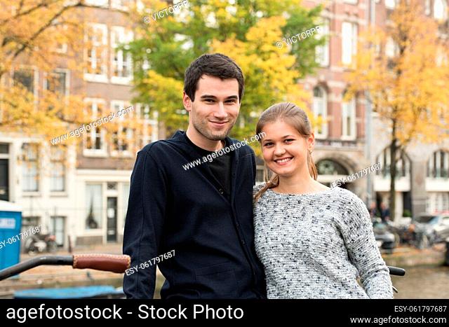 young couple, man and woman sightseeing in Amsterdam, Netherlands