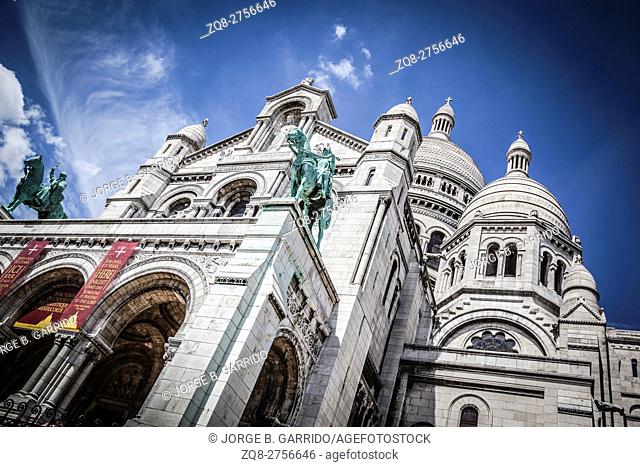 Basilica Sacre Coeur with monument, Paris