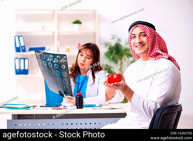 Arab businessman visiting caucasian female doctor