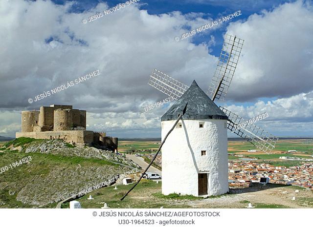 Typical windmill and castle in Consuegra village, in the Route of Don Qiuijote, Toledo province, Castilla-La Mancha, Spain