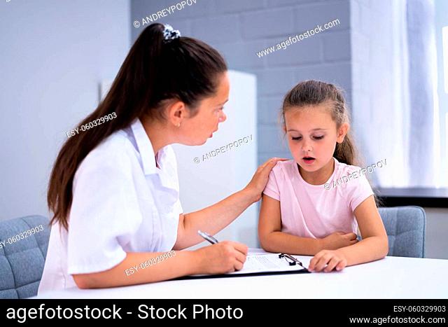 Sick Child Therapy. Therapist Comforting Kid At Hospital