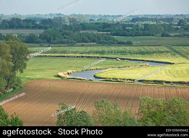 Beautiful countryside landscape with fields and small river near Kiel - Schleswig-Holstein - Germany