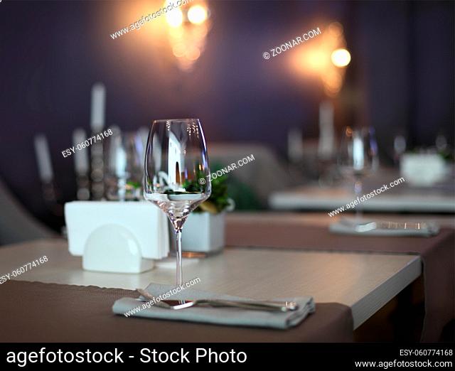 Empty glasses set in restaurant with copy space