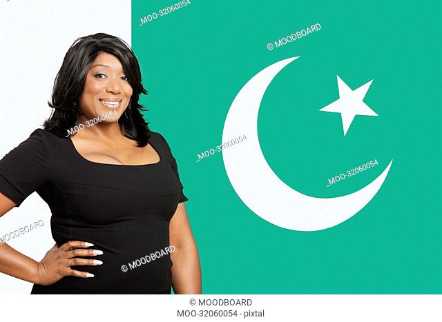 Portrait of casual mixed race woman against Pakistani flag