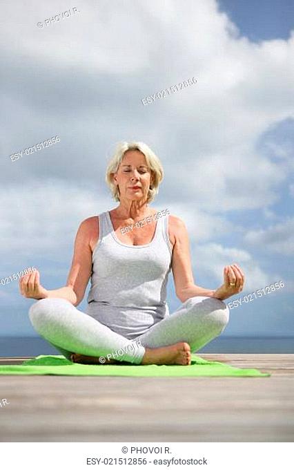 mature woman meditating