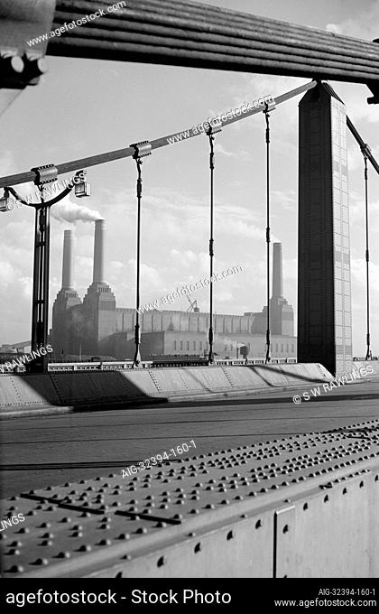 BATTERSEA POWER STATION FROM CHELSEA BRIDGE, London. A view looking across the suspension bridge towards the power station (the building's fourth chimney was...