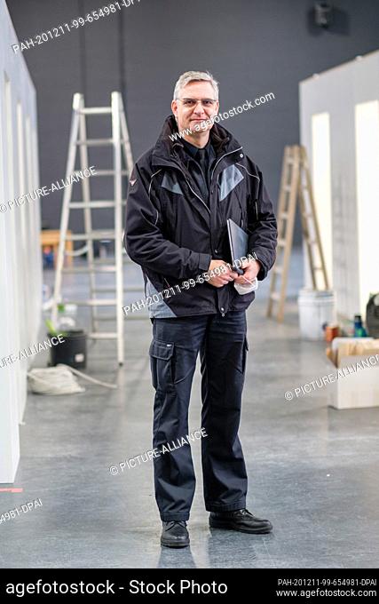 11 December 2020, Lower Saxony, Wolfsburg: Manuel Stanke, head of the Wolfsburg fire and disaster control department, is standing in the vaccination centre at...