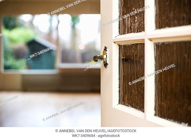 Door knob close-up to the livingroom, home concept new