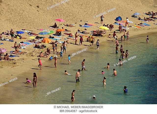 Bathing on the beach, Playas de Papagayo or Papagayo beaches, Monumento Natural de los Ajaches nature park, Lanzarote, Canary Islands, Spain