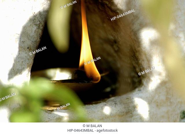 OIL LAMP LIT IN THE THULASITHARA