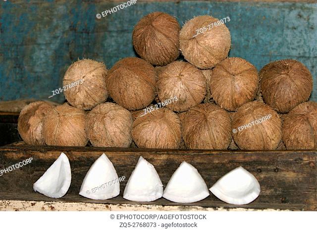 Dehusked coconuts and kernels on display
