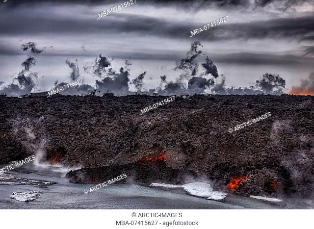 Hot lava steaming. Eruption site at Holuhraun near Bardarbunga Volcano, Iceland. August 29, 2014 a fissure eruption started in Holuhraun at the northern end of...