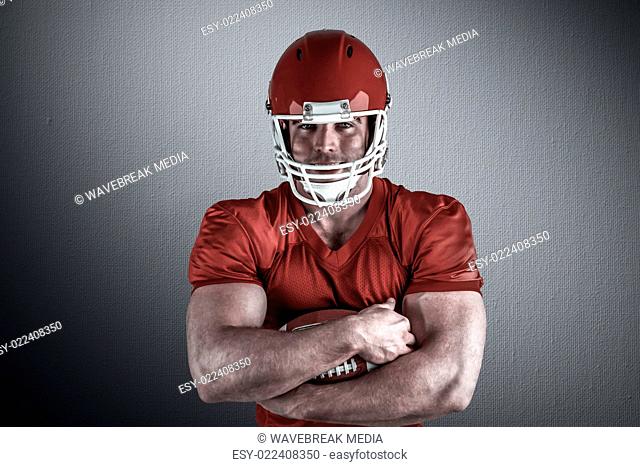 Composite image of american football player with ball
