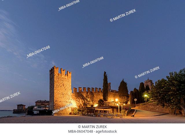 View to the Castello Scaligero in the morning at blue hour, Italy, Brescia, Lombardy, Lake Garda, Sirmione