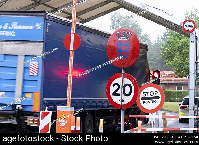 dpatop - 13 June 2020, Schleswig-Holstein, Harrislee: A truck passes the border crossing to Denmark in Padborg. The border crossing was opened on Saturday...