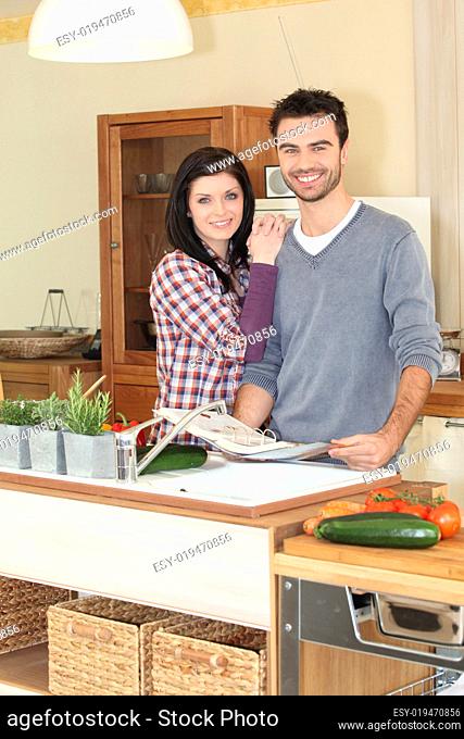 Smiling woman and man in kitchen