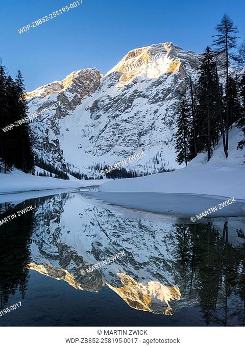 Lake Prager Wildsee (Lago di Braies) in the nature park Fanes Sennes Prags, part of UNESCO World Heritage Dolomites, during winter in deep snow