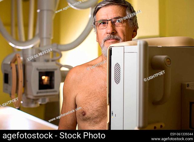 Senior man x-ray medical scan examination in a modern hospital (color toned image)
