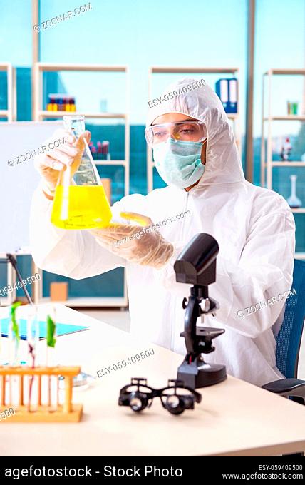 Male biotechnology scientist chemist working in the lab