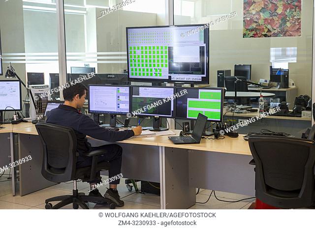 Scientist working in a control room at ALMA (Atacama Large Millimeter/submillimeter Array). ALMA has 66 radio telescopes in the Atacama Desert of northern Chile