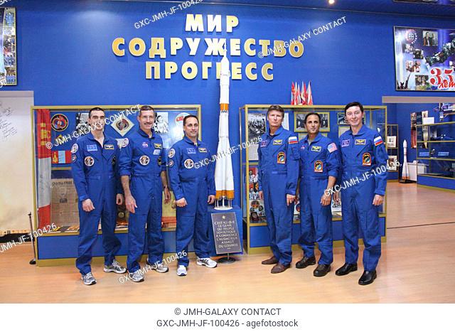 At the Baikonur Cosmodrome in Kazakhstan, the Expedition 30 prime and backup crews toured the Korolev Museum Nov. 9, 2011 and pose for pictures around a model...