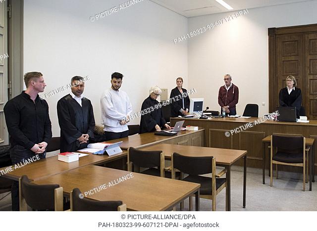 23 March 2018, Germany, Hamburg: Youtuber and defendant Ahmed Ahadi (ApoRed, 3.l) and his 26-year-old co-defendant (l), as well as lawyers Kemal Su (2