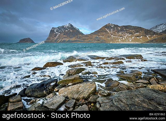 Rocky coast of fjord of Norwegian sea in winter. Lofoten islands, Norway, Europe