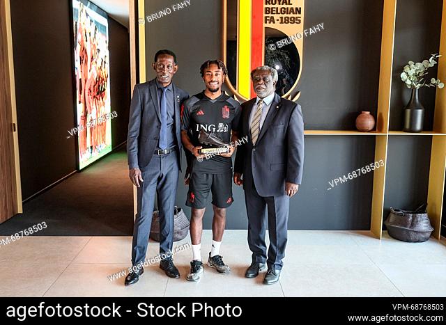 Belgium's Mike Tresor (C) receives his Ebony shoe after a press conference of Belgian national soccer team Red Devils, Tuesday 13 June 2023