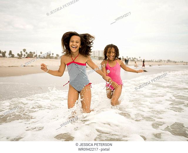 USA, California, Los Angeles, Two girls 6-11 playing on beach