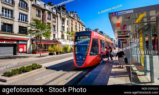Passengers board a tram in the Ruse de Vesle, Reims, France