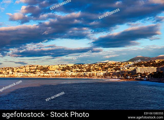 France, Cote d'Azur, Nice, city skyline at sunrise from Mediterranean Sea