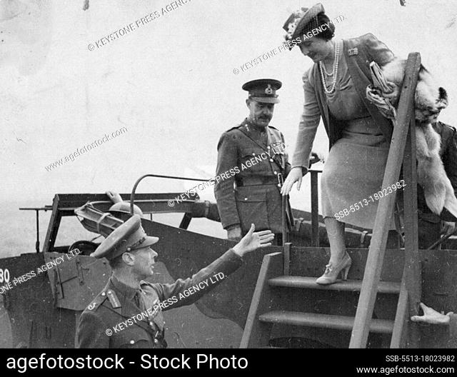 King helps Queen alight from ***** car. August 31, 1941. (Photo by Keystone Press Agency Ltd.)