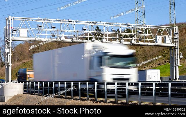 Hagen, North Rhine-Westphalia, Germany - truck drives under toll bridge on the A45 motorway