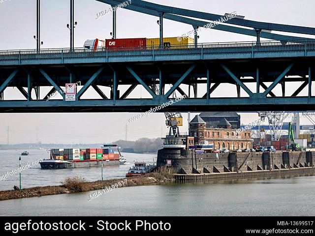 Krefeld, North Rhine-Westphalia, Germany - The Rheinhafen Krefeld is the fourth largest port in North Rhine-Westphalia, a container ship drives past the KCT...
