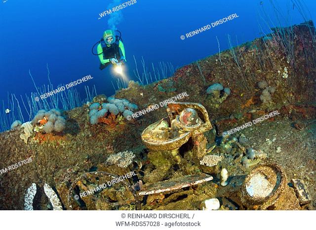 Diver discover Artifacts at Wreck of USS Carlisle Attack Transporter, Bikini Atoll, Micronesia, Pacific Ocean, Marshall Islands