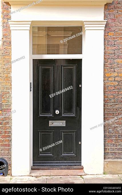 Classic Black Door at Old House in London