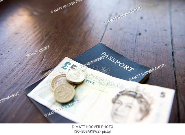 British banknote, coins and passport