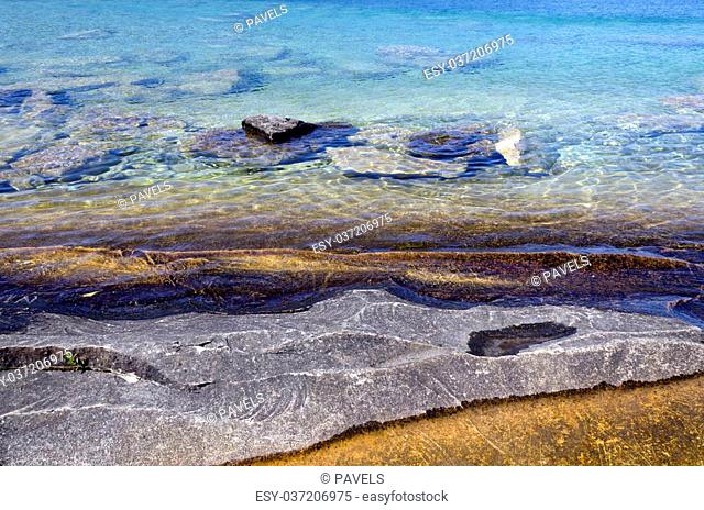 Rock under clear water at shore of Georgian Bay of Lake Huron Ontario