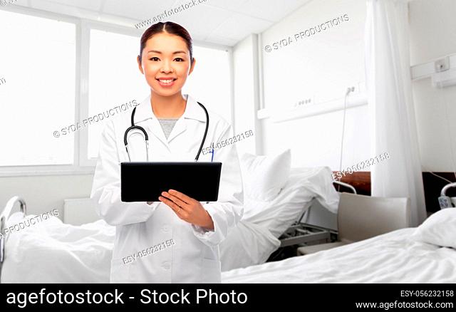 asian female doctor with tablet pc at hospital